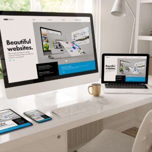 A professional business website development showcase by AUZ Studio, featuring a "Beautiful websites" landing page displayed simultaneously on a desktop monitor, laptop, tablet, and smartphone on a clean white desk.