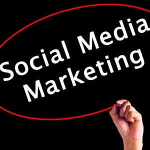 A hand circling the words "Social Media Marketing" in white text with a red marker on a black background, representing strategic advertising services by AUZ Studio.