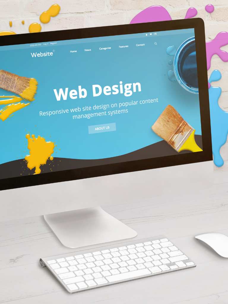 A desktop computer monitor displaying a "Web Design" homepage with vibrant blue and yellow paint splatters and brushes, emphasizing responsive design on popular content management systems by AUZ Studio.